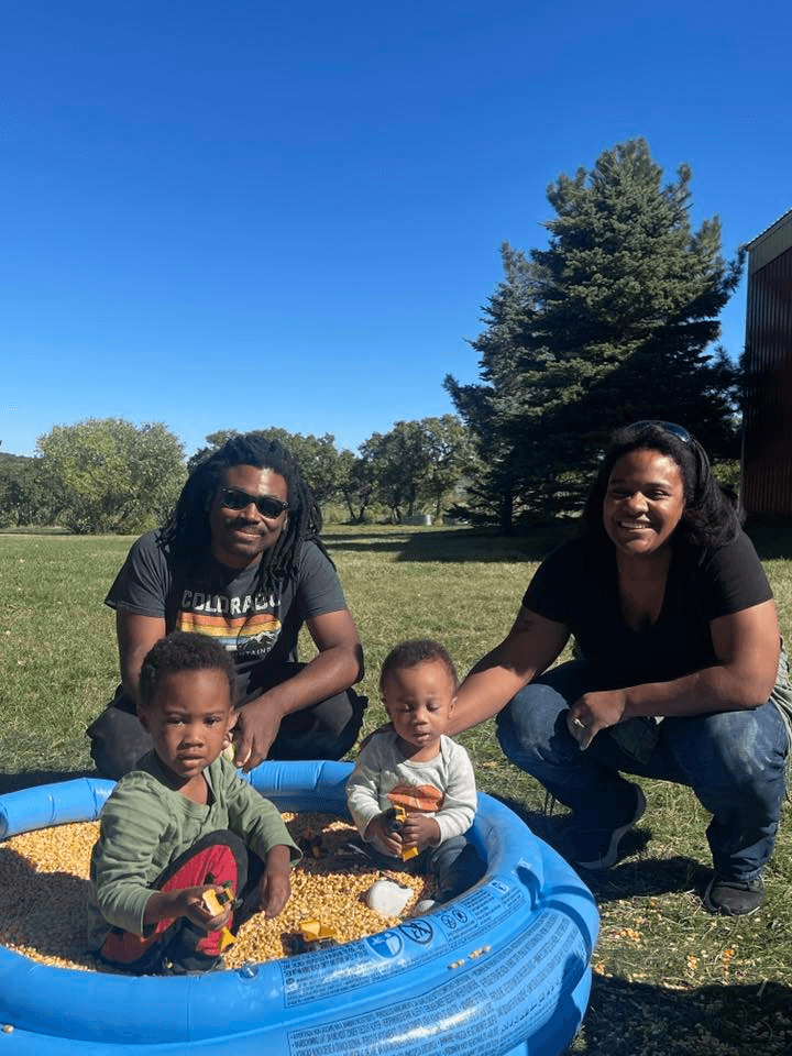 Devin and Ronald Porch with their two children outdoors